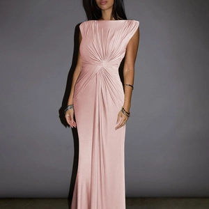 Detail of pink sleeveless maxi dress featuring elegant pleated waist and silky fabric
