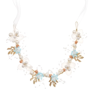 Detail of bridal headband with gold leaves, white pearls and blue flowers on white ribbons
