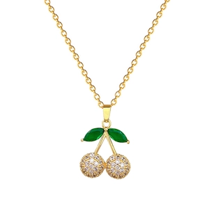 Elegant gold cherry necklace with green leaf stones and pavé cubic zirconia pendant