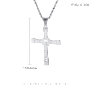 Macro shot of silver stainless steel cross pendant with crystals and dimensions 58x42mm