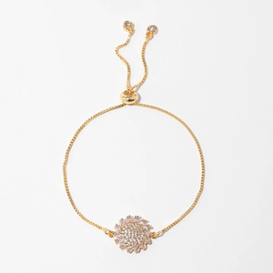 Detail of adjustable gold sunflower bracelet featuring cubic zirconia and sliding clasp