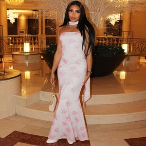 Detail of white tube maxi dress featuring pink floral prints and a matching choker