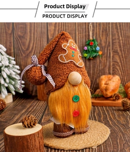 Close-up of Christmas gnome with gingerbread man embroidery and orange faux fur beard