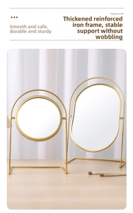 Detail of minimalist gold iron desktop makeup mirrors in round and oval shapes