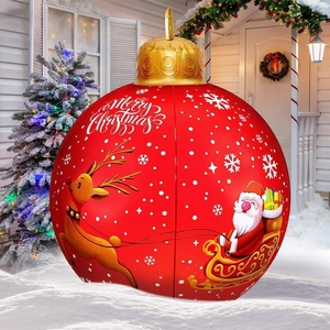 Inflatable red Christmas ball with Santa and reindeer on snowy yard background