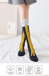 Detail of chicken feet pattern on black cotton over-knee socks with tight yarn weave