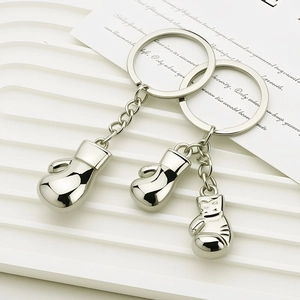 3D metallic boxing glove keychain in silver finish for fitness enthusiasts and gifts