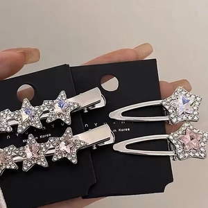 Sparkling pink rhinestone star hair clips with silver alloy base on display card