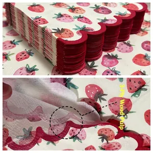 Three-ply strawberry print cocktail napkins with elegant red scalloped edges for parties
