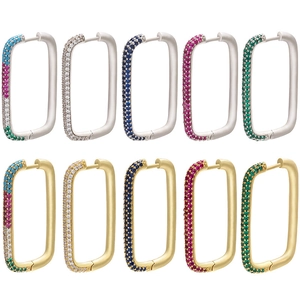 Detail view of rectangular pave-set zircon hoop earrings in gold and silver finishes