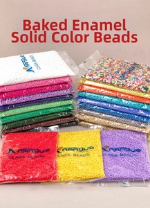 Macro shot of assorted colorful glass seed beads in retail bags for DIY jewelry making