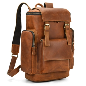 Detailed side view of high-capacity crazy horse leather backpack with brass buckles