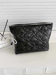 Black quilted heart storage bag with pearl bow keychain and silver heart charm decoration