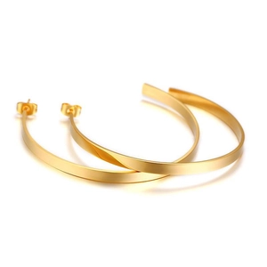 Minimalist matte gold C-shaped hoop earrings with a flat profile and satin finish