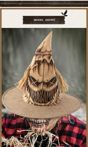 Macro detail of burlap scarecrow witch hat featuring a stitched creepy face for Halloween