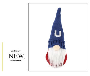 Macro detail of knitted gnome with white letter U on blue hat for USA party decor