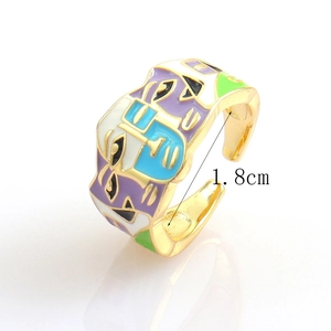 Detail view of gold-plated ring with colorful enamel face art and 1.8cm diameter