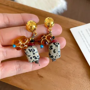 Vintage stone drop earrings featuring natural spotted agate and gold hammer-textured studs