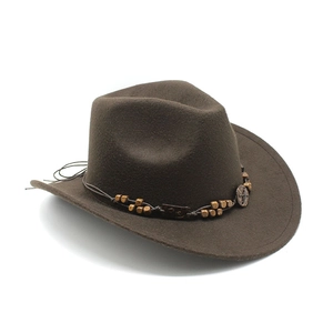 Close-up of brown wool felt cowboy hat with braided rope band and vintage bead detail
