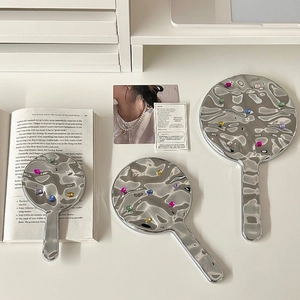 Chic silver wavy handheld mirrors with colorful rhinestones in Y2K aesthetic