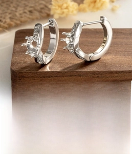 Detailed view of silver titanium steel crown earring hoops with 0.8mm pins