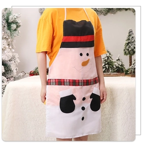 Detailed view of a white Christmas snowman apron with red scarf design worn by a model