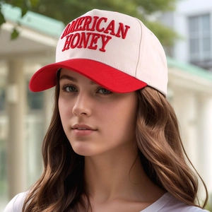 Close-up of red 3D embroidery saying American Honey on ivory white baseball cap