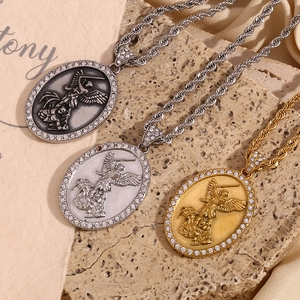 Macro view of detailed angel pendants on twist rope chains in gold and silver finish