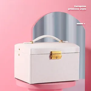 Three-layer white PU leather jewelry organizer box with a gold lock and top handle