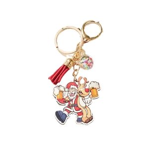 Christmas star sequin ball keychain featuring cartoon Santa and reindeer with red tassel