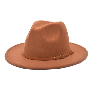 Detailed macro view of the brown wool fedora featuring a leather band and metal buckle