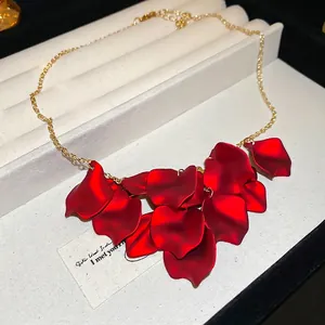 Minimalist red layered petal necklace with gold chain and matte floral pendant