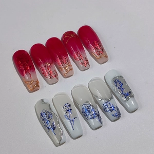 Red and white coffin nails with 3D gold embossed floral patterns and rose prints