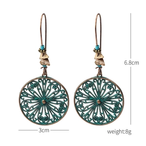 Detailed view of bohemian antique bronze earrings with size dimensions 6.8cm by 3cm