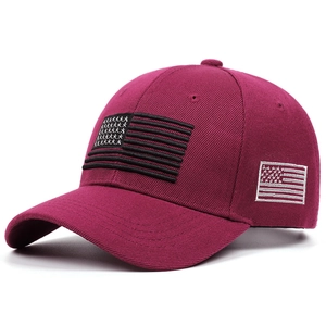 Detailed close-up of premium cotton baseball cap featuring embroidered flag patterns