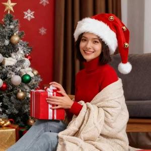 Close-up of red plush Christmas hat with white faux fur trim and golden bells on a model