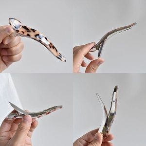 Large tortoiseshell marble pattern hair claw clip shown from four different angles