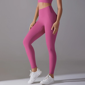 Detailed view of high-waist magenta yoga pants with wide shaping waistband for fitness