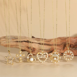 Elegant gold necklaces with star, cross, and heart pendants featuring pearls and cubic zirconia