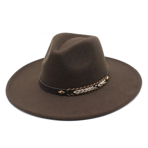 Detailed view of coffee brown wool fedora hat with studded leather band and weaving