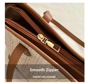 Close-up of the smooth metal zipper closure and inner pocket on woven tote bag