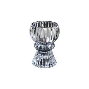 European style ribbed glass candle holder with a pedestal base and vertical texture