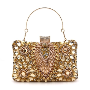 Golden luxury evening clutch bag with sparkling champagne rhinestones and metal handle