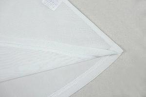 Detailed macro view of white breathable mesh fabric with high-quality double-needle stitching