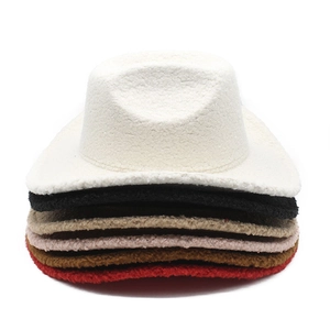Close-up of colorful sherpa western cowboy hats stacked to show warm winter textures