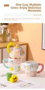 Detail of hand-painted embossed ceramic mug with strawberry pattern and bubble handle