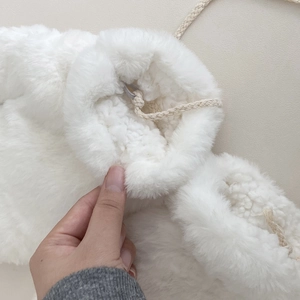 White faux fur thermal mittens with fleece lining and adjustable drawstring closure