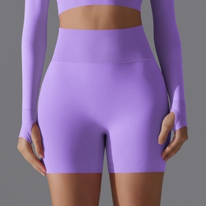 Seamless purple high-waisted yoga shorts and long sleeve crop top fitness set for women
