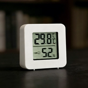 Mini digital indoor thermometer and hygrometer with LCD display in white finish