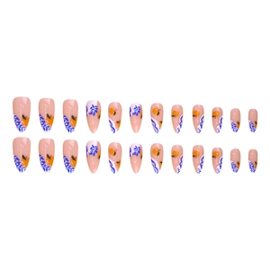 Almond-shaped press-on nails with pale pink base and hand-painted blue leaf citrus patterns